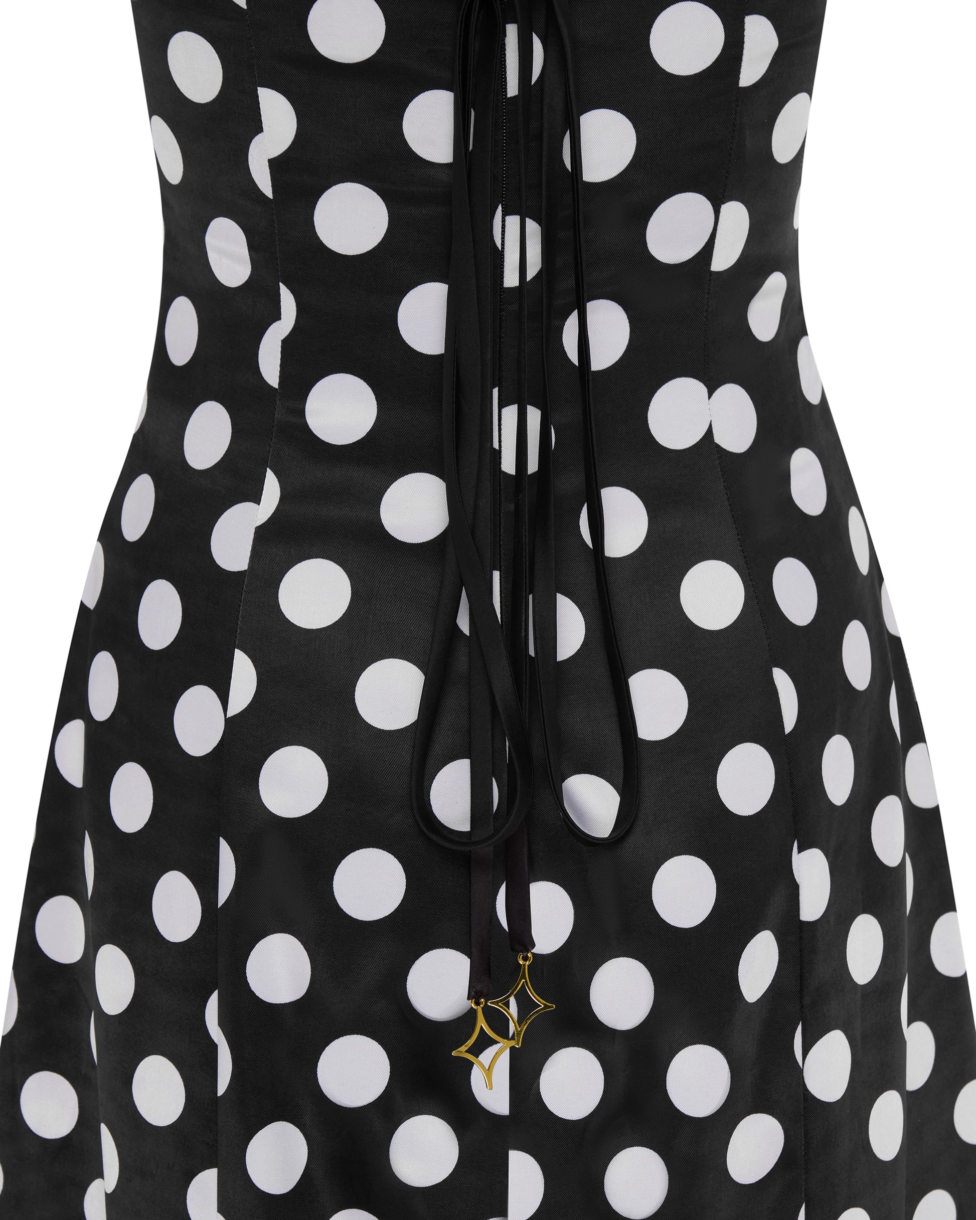 Polka dot fitted jumpsuit with shawl. Close up
