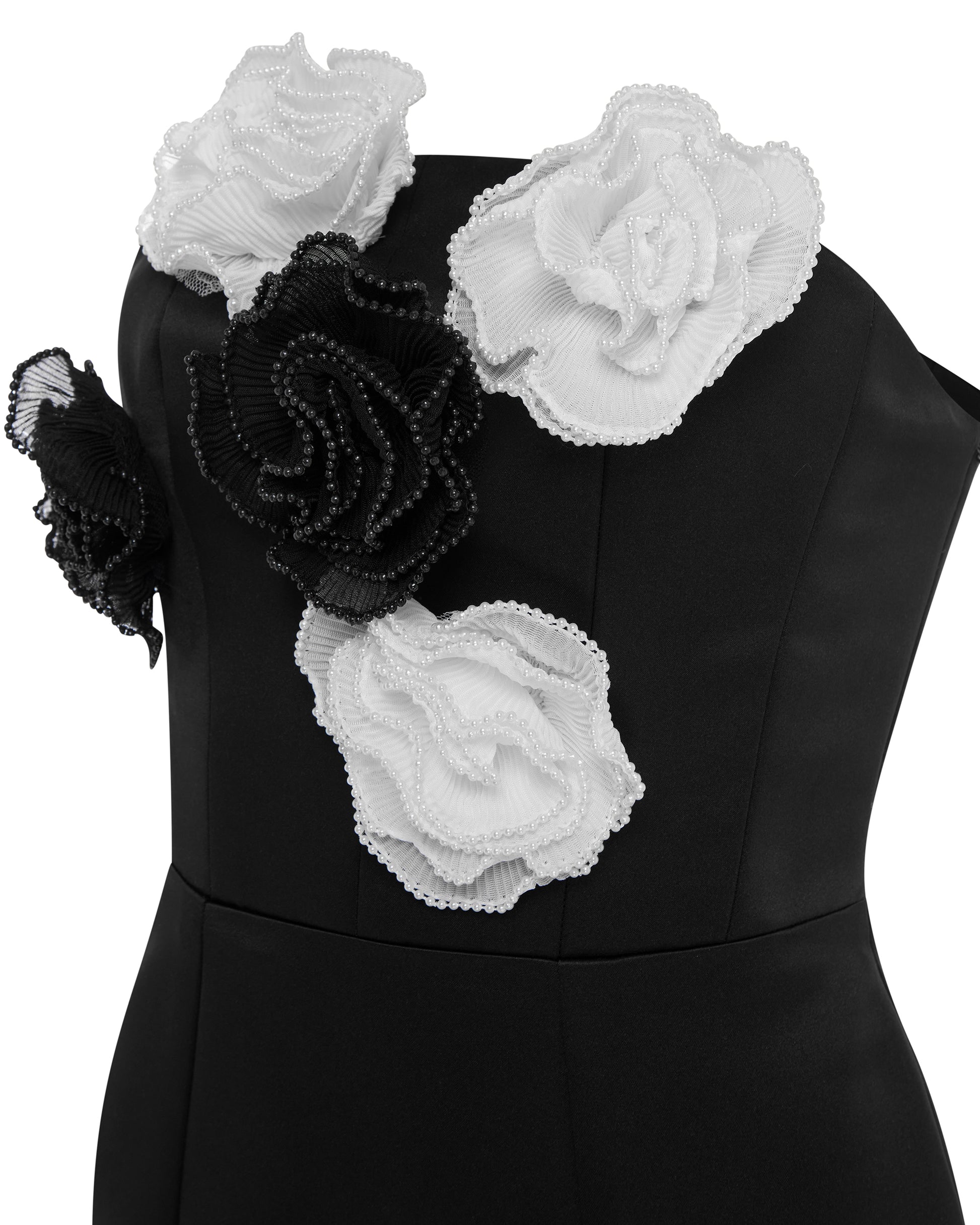 Black fitted midi dress with black and white flower detailing. Detail
