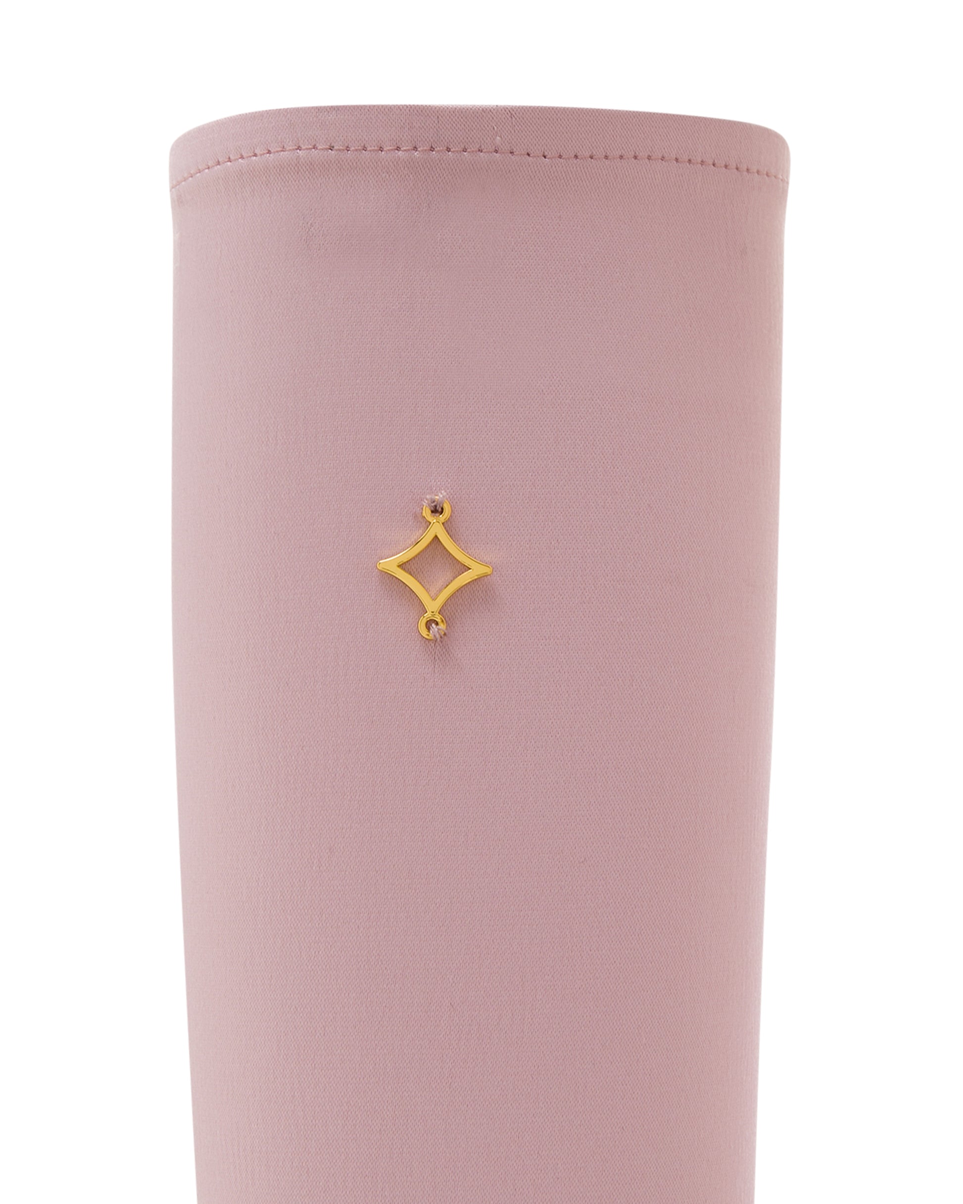 Pink satin gloves, close up. 