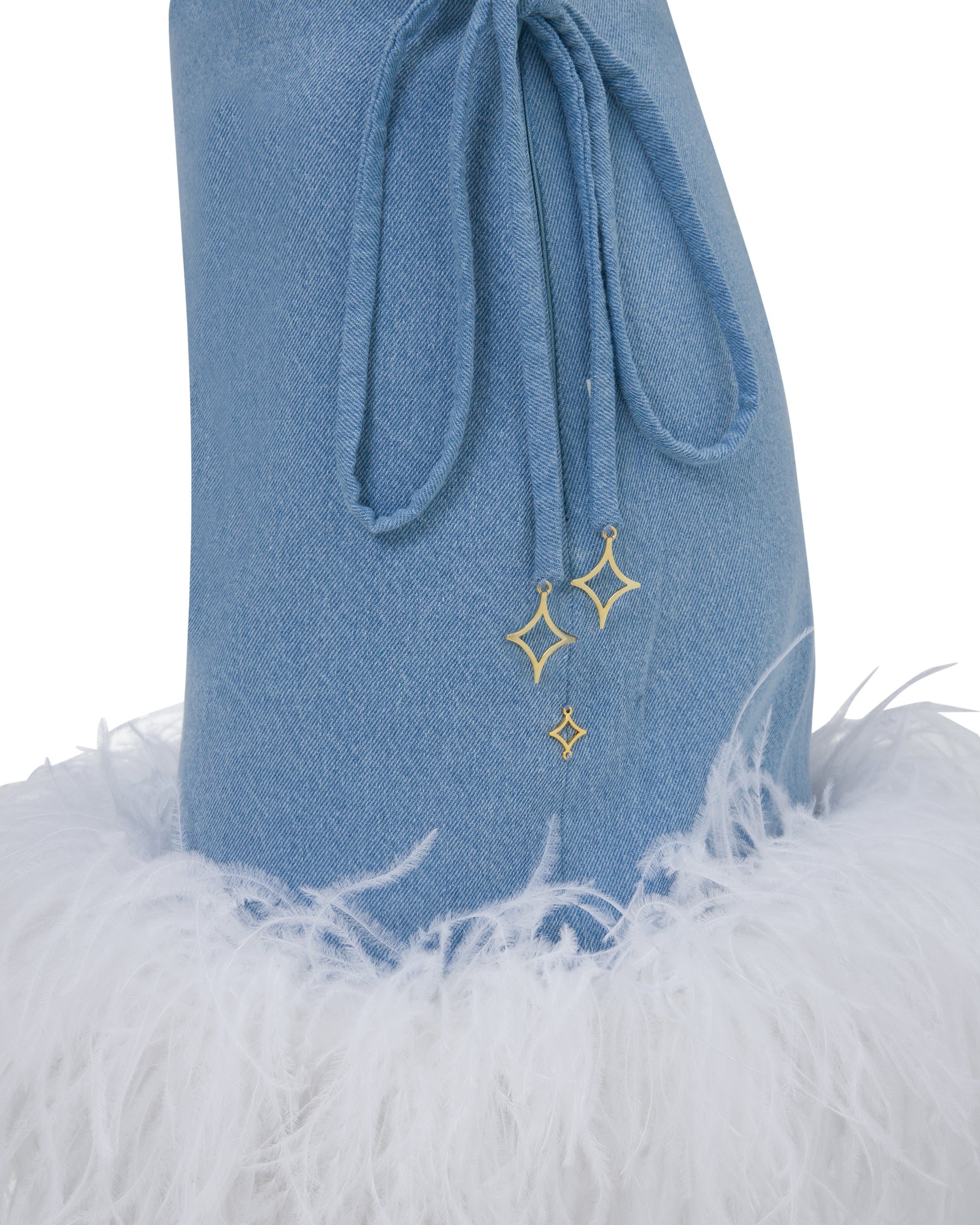 Denim mini skirt with ivory feathered hem. Side