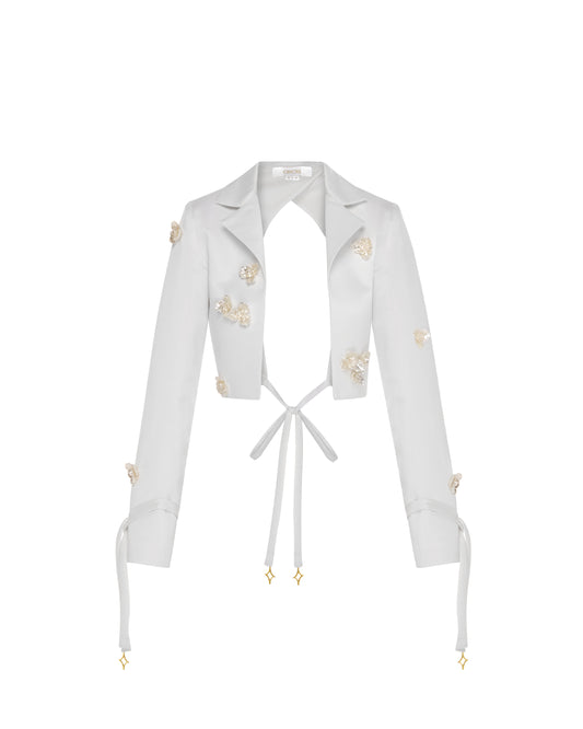 Cut out ivory blazer, cropped, flower Aplique, front. 