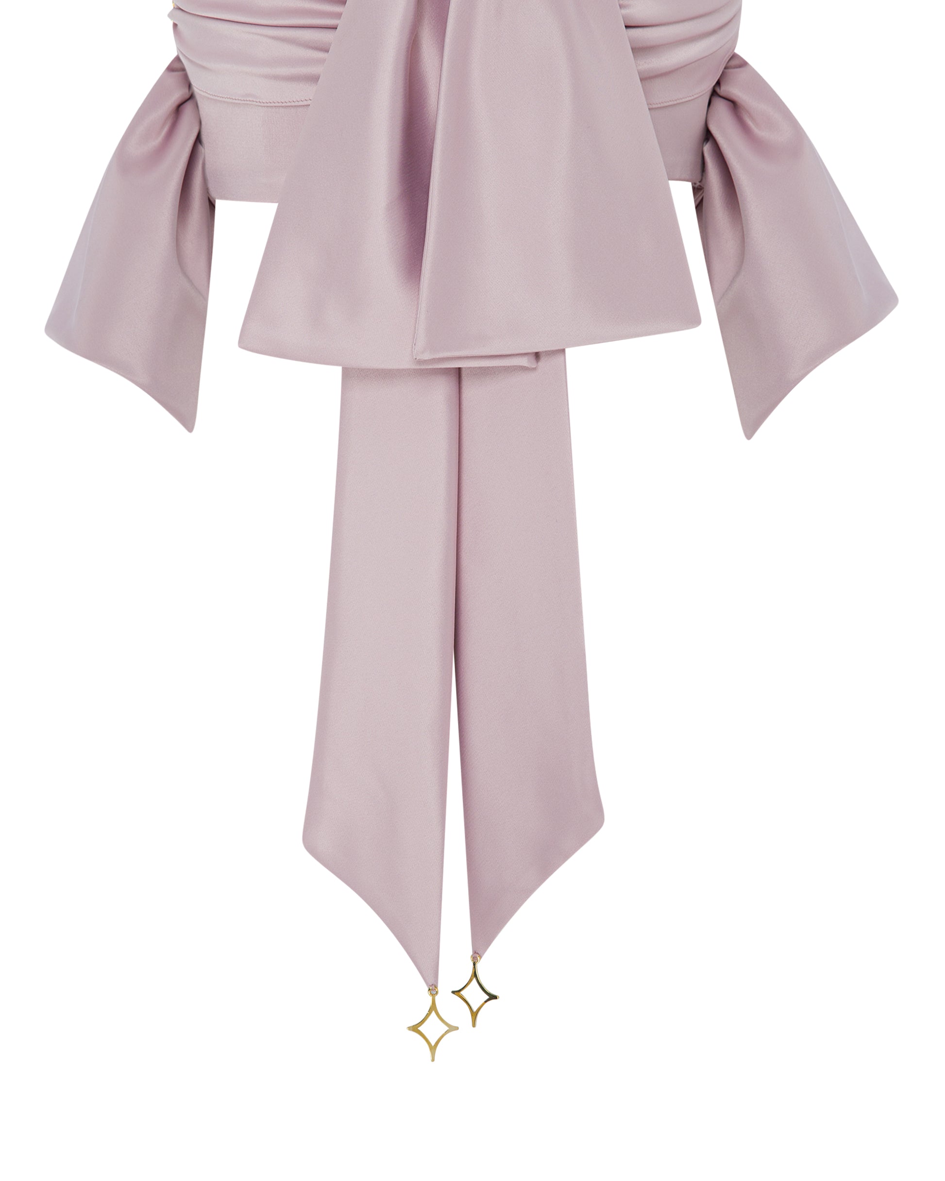 Pink cropped stop with bow detailing. Detailed shot. 
