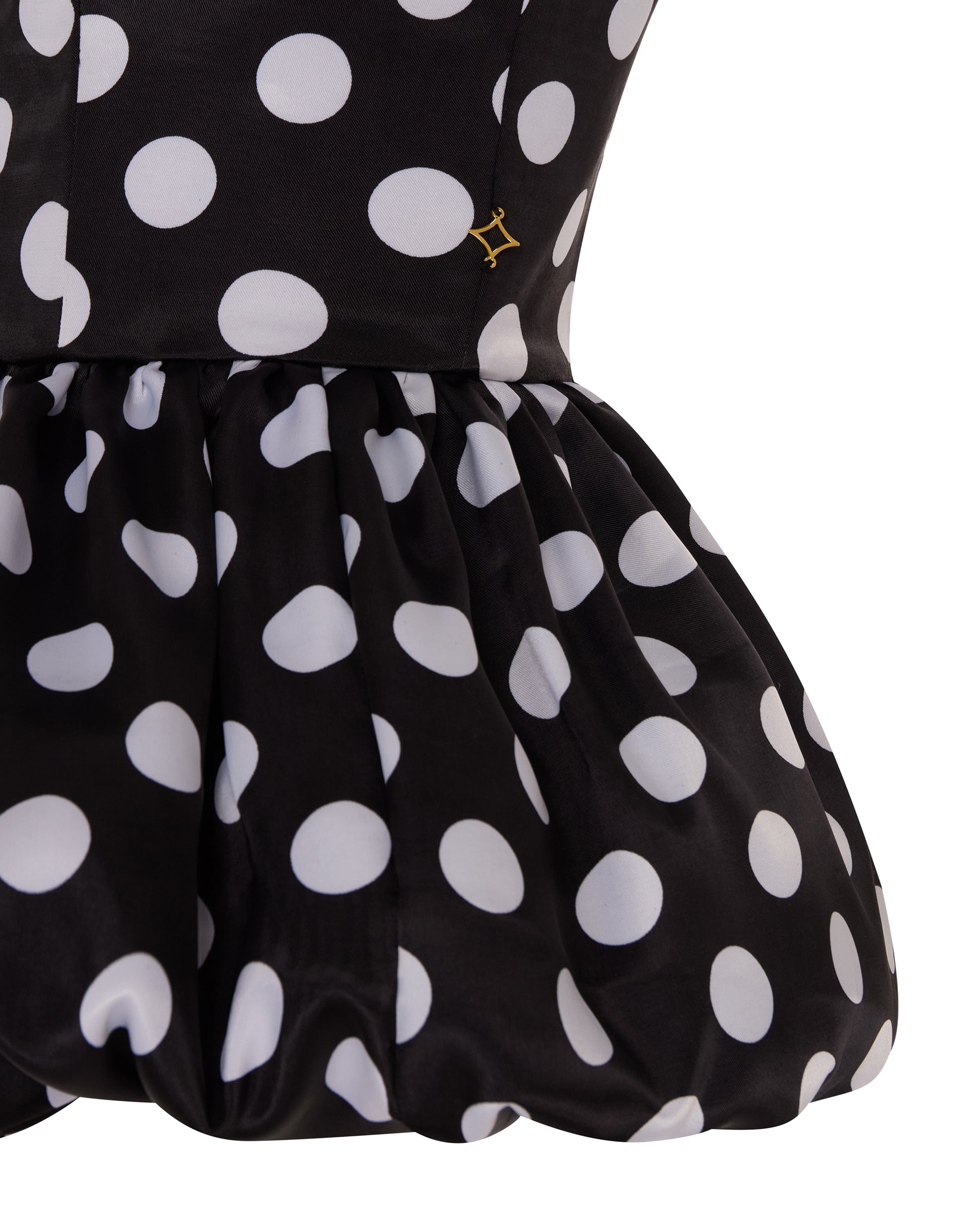 Polka dot peplum top. Close up