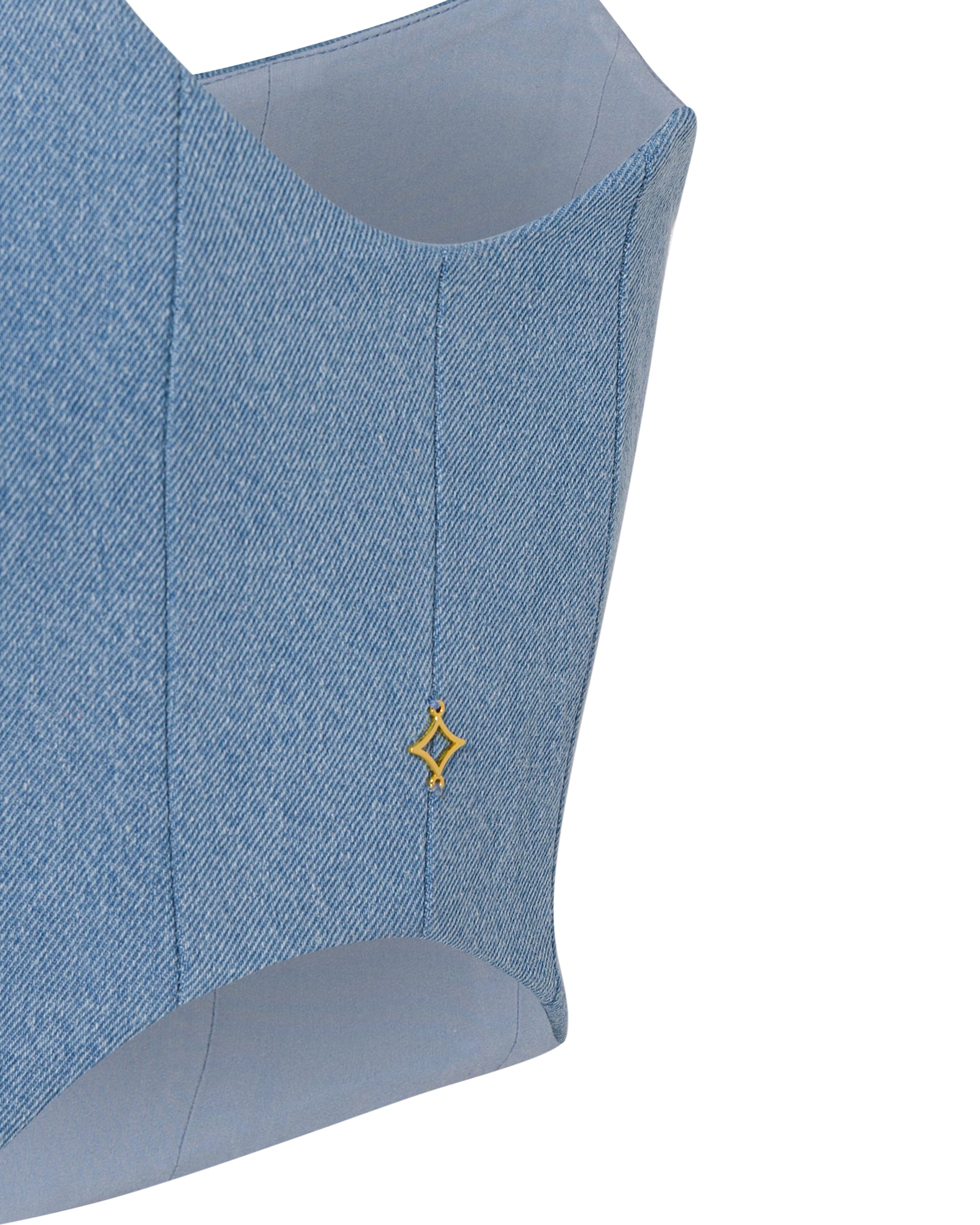 Denim mini skirt with ivory feathered hem. Close up