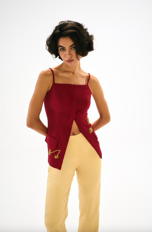 Tailored ankle length trousers, yellow, front. Front. Red Vest with embroidery and front buttons. 