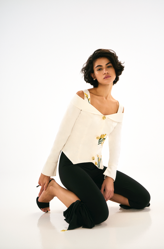Full sleeve vest with embroidery. Ivory, Front. Belle capri, black with bow detailing. 