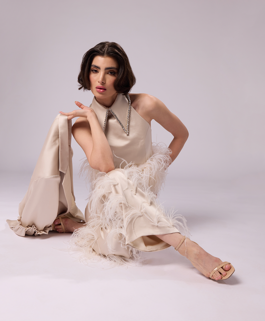 Champagne satin blazer with ruffled sleeves..  Crystal collared champagne satin top with feather trimmed hem. Front