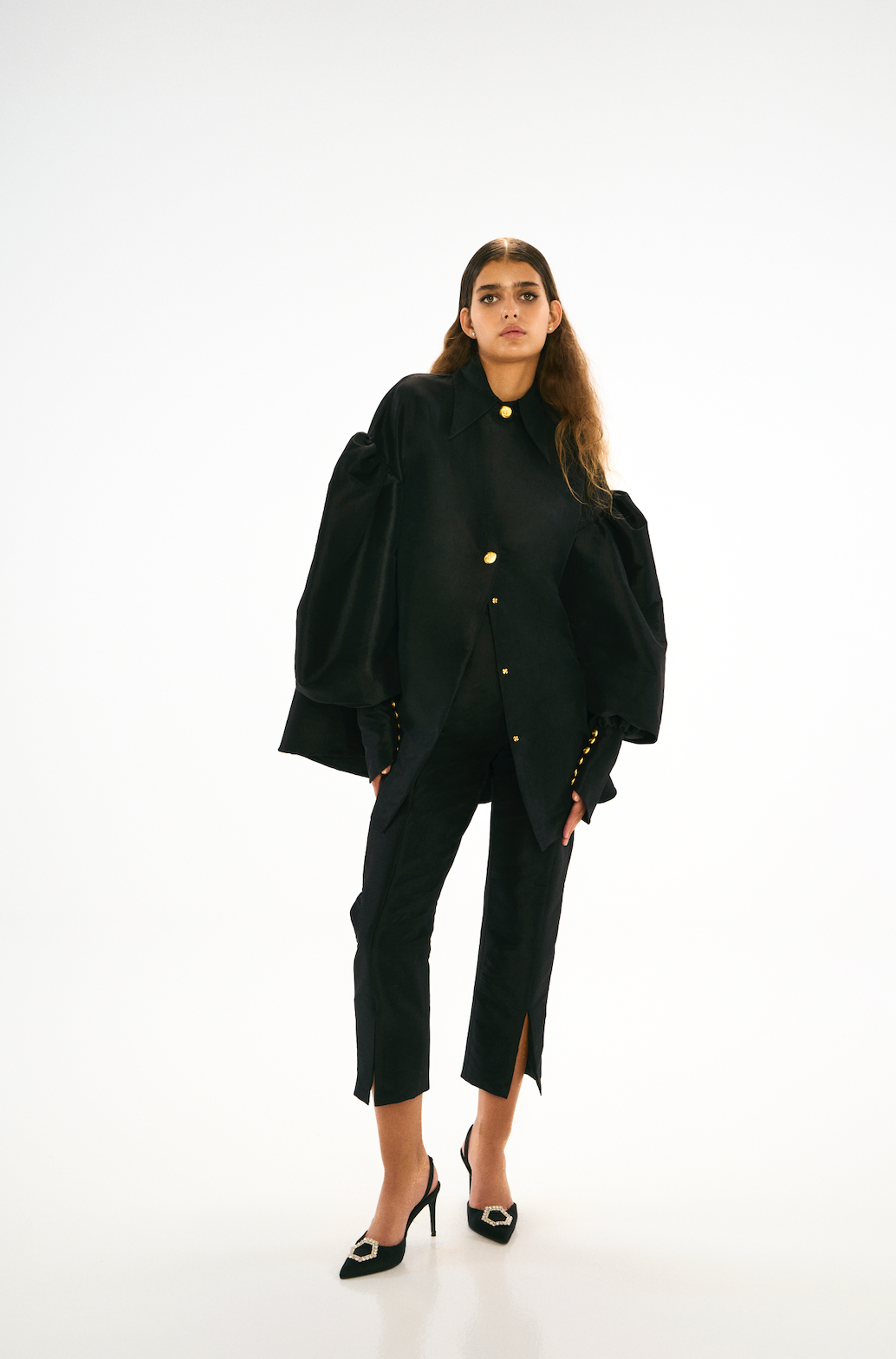 Black, high waisted, tailored pants. Front