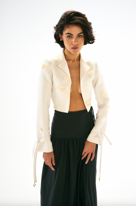 Cut out ivory blazer, cropped, flower Aplique, front. 